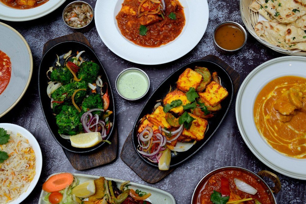 A table of Himalayan curries, rice and bread